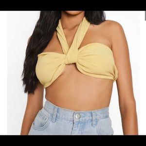 A yellow sleeveless, backless garment with serious sex appeal.